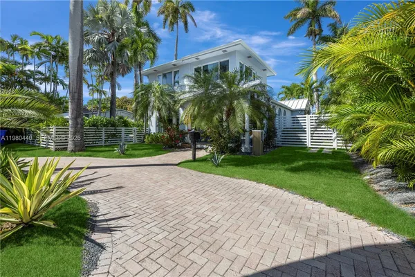 a living room with furniture or couch and a large window