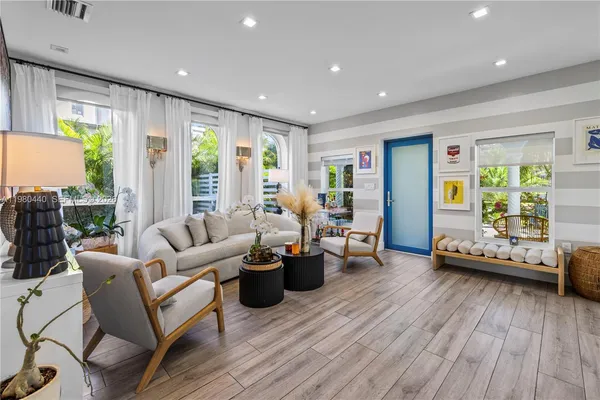 a living room with furniture and a large window