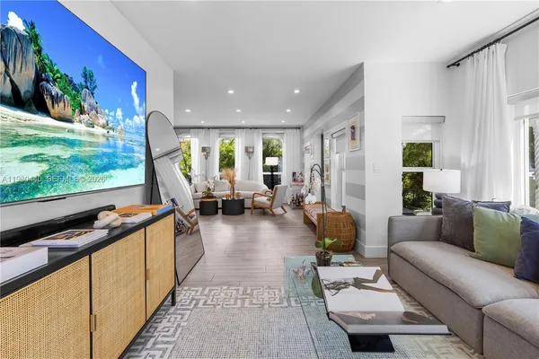a view of staircase with wooden floor and a window