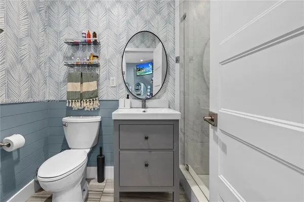 a view of an entryway of a house and wooden floor