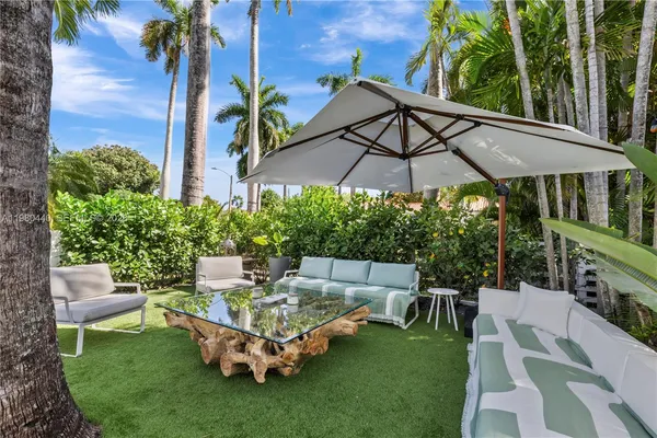 swimming pool view with a garden space