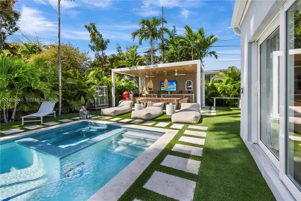 a view of a patio with couches table and chairs