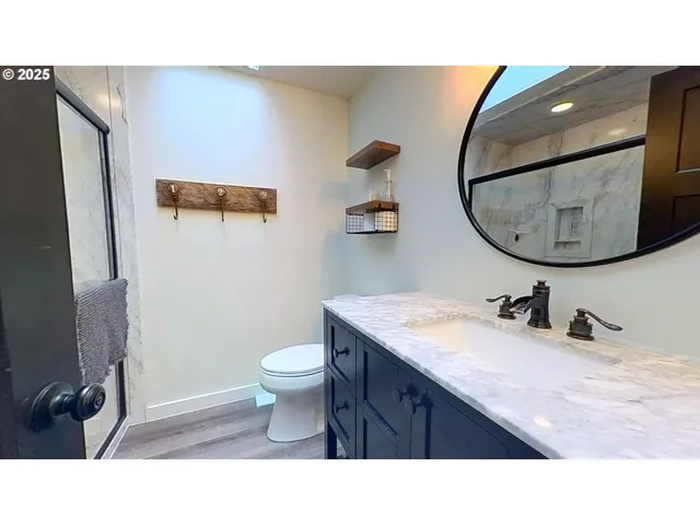 a kitchen with a wooden floor and a window