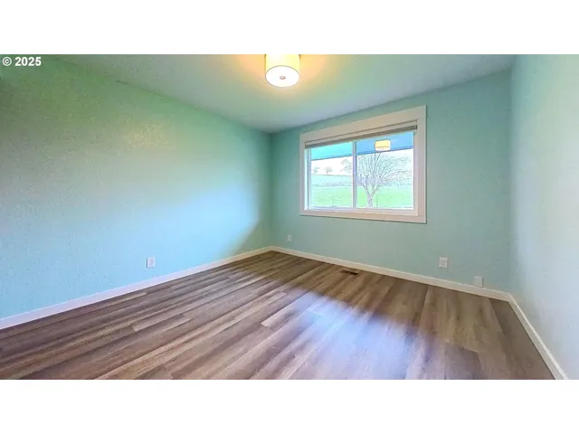 a bathroom with a shower and mirror