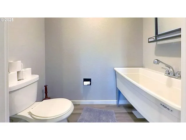 a view of a hallway with washer and dryer