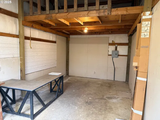 a view of green field with house in background