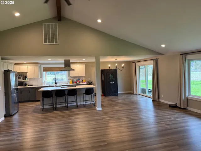a view of kitchen with cabinets and wooden floor