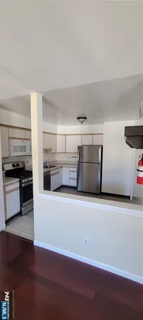 a view of a kitchen with a sink