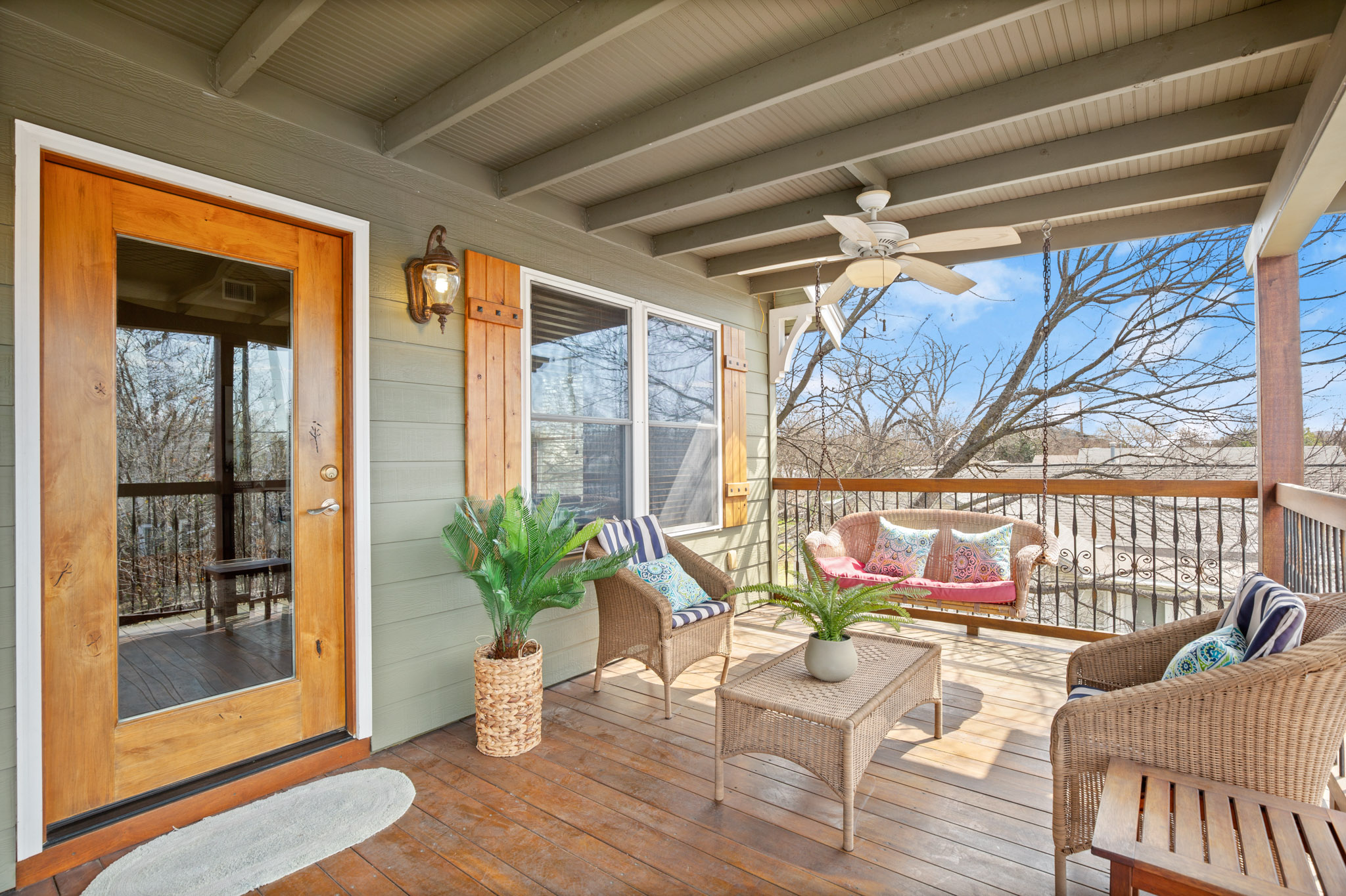 912 East 51st Street Austin, TX 78751 - Photo 1 of 1 Wooden terrace featuring a ceiling fan and outdoor lounge area