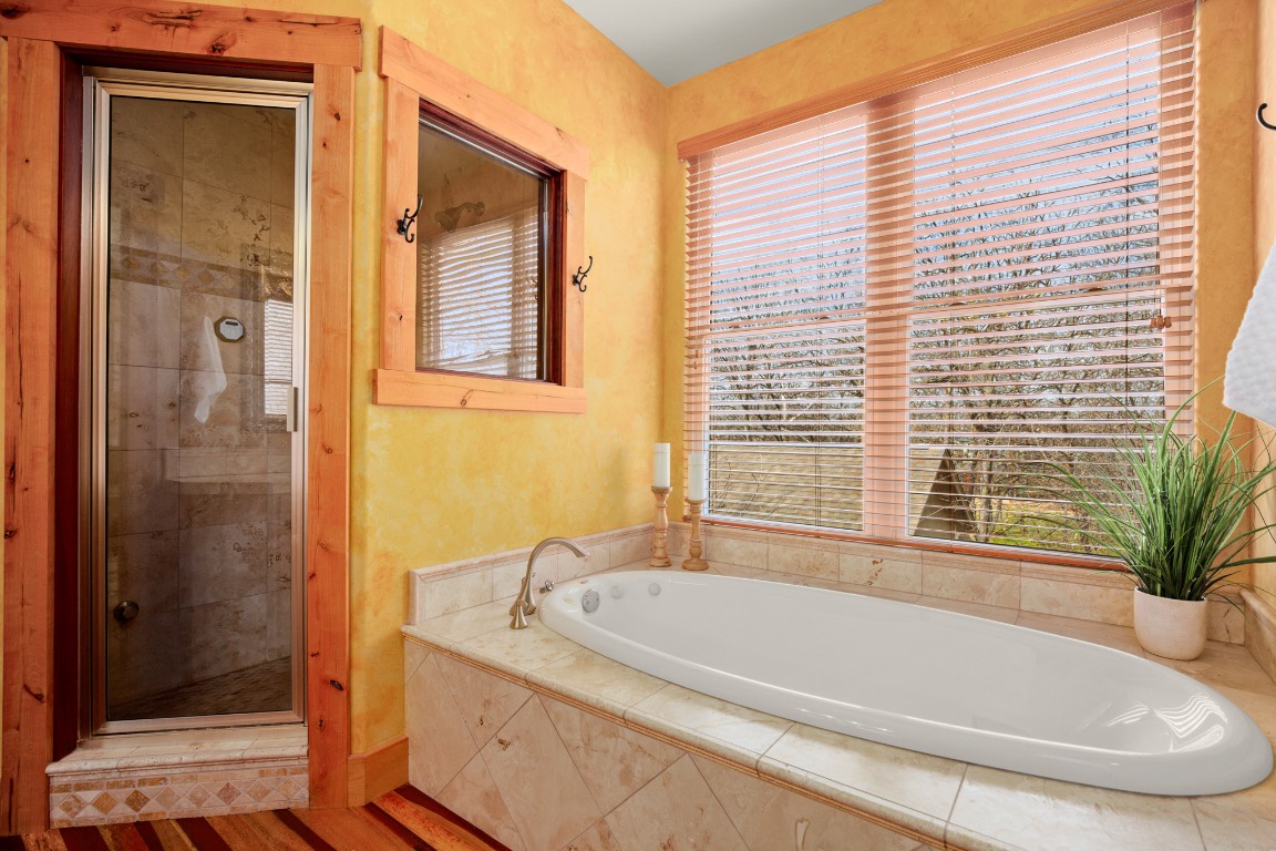 912 East 51st Street Austin, TX 78751 - Photo 14 of 38 a white bath tub sitting next to a shower
