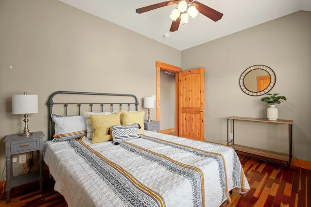 a bedroom with a bed and a chandelier