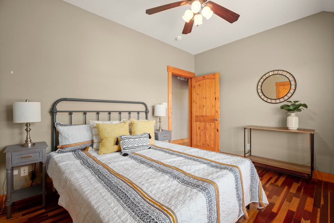 912 East 51st Street Austin, TX 78751 - Photo 19 of 38 a bedroom with a bed and a chandelier