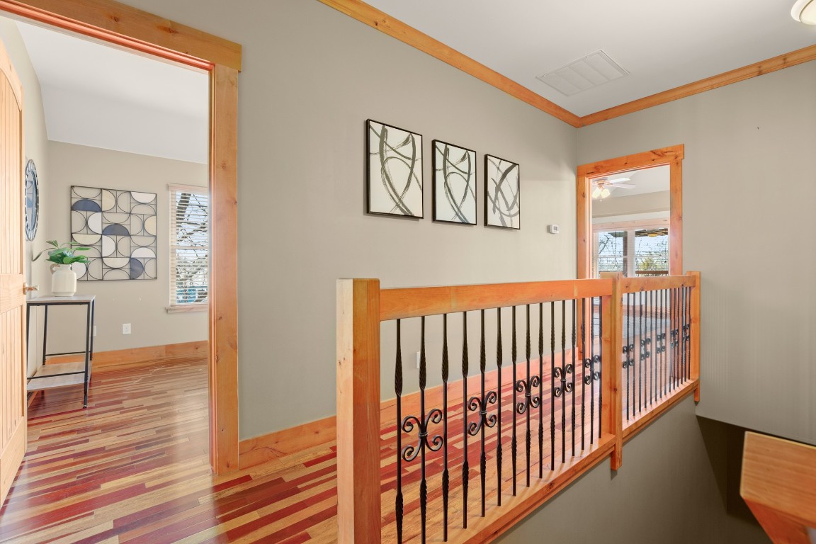 912 East 51st Street Austin, TX 78751 - Photo 22 of 38 a view of a hallway with wooden floor and windows