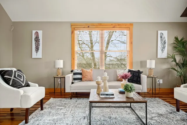 a living room with furniture and a window