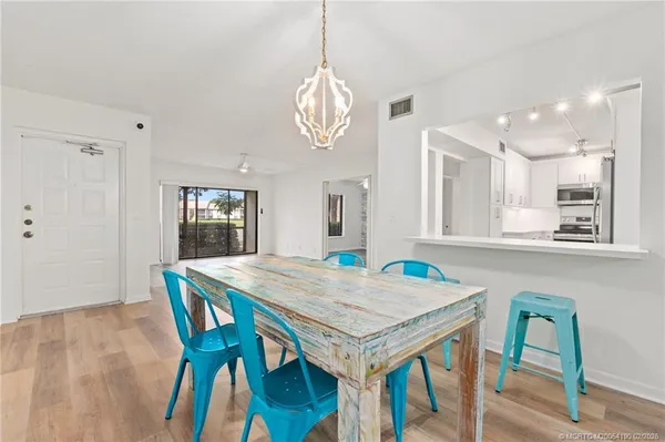 a view of a dining table and chairs in a room