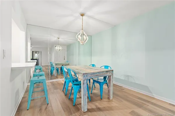 a dining room with a table and chairs