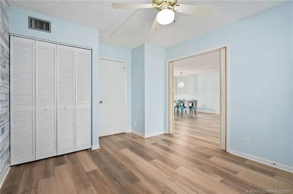 a view of a livingroom with wooden floor