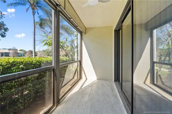 a view of balcony with wooden floor