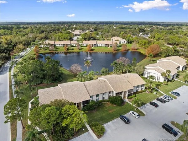 an aerial view of a house with a lake view