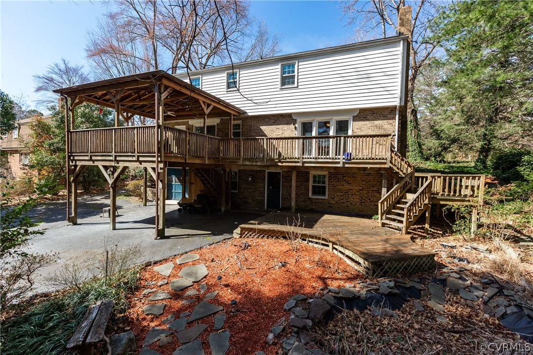 57 Goodward Road Richmond, VA 23236 - Photo 3 of 33 Large deck area, gardens, rear garage/workshop