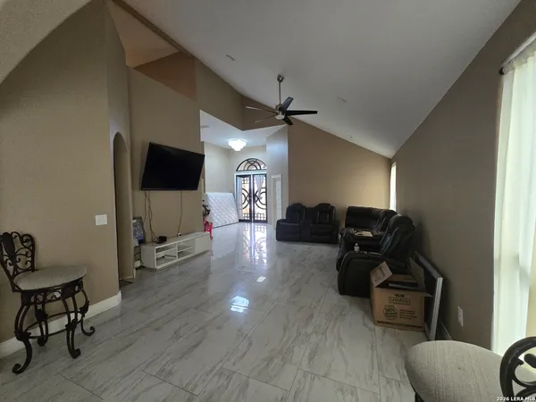 a living room with furniture and a flat screen tv