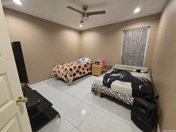 a bedroom with bed and window