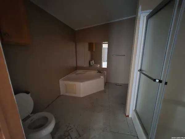 a bathroom with a toilet and a sink