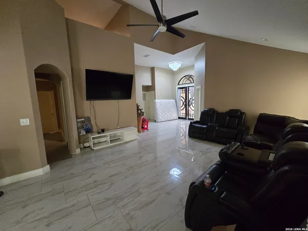 a living room with furniture and a flat screen tv
