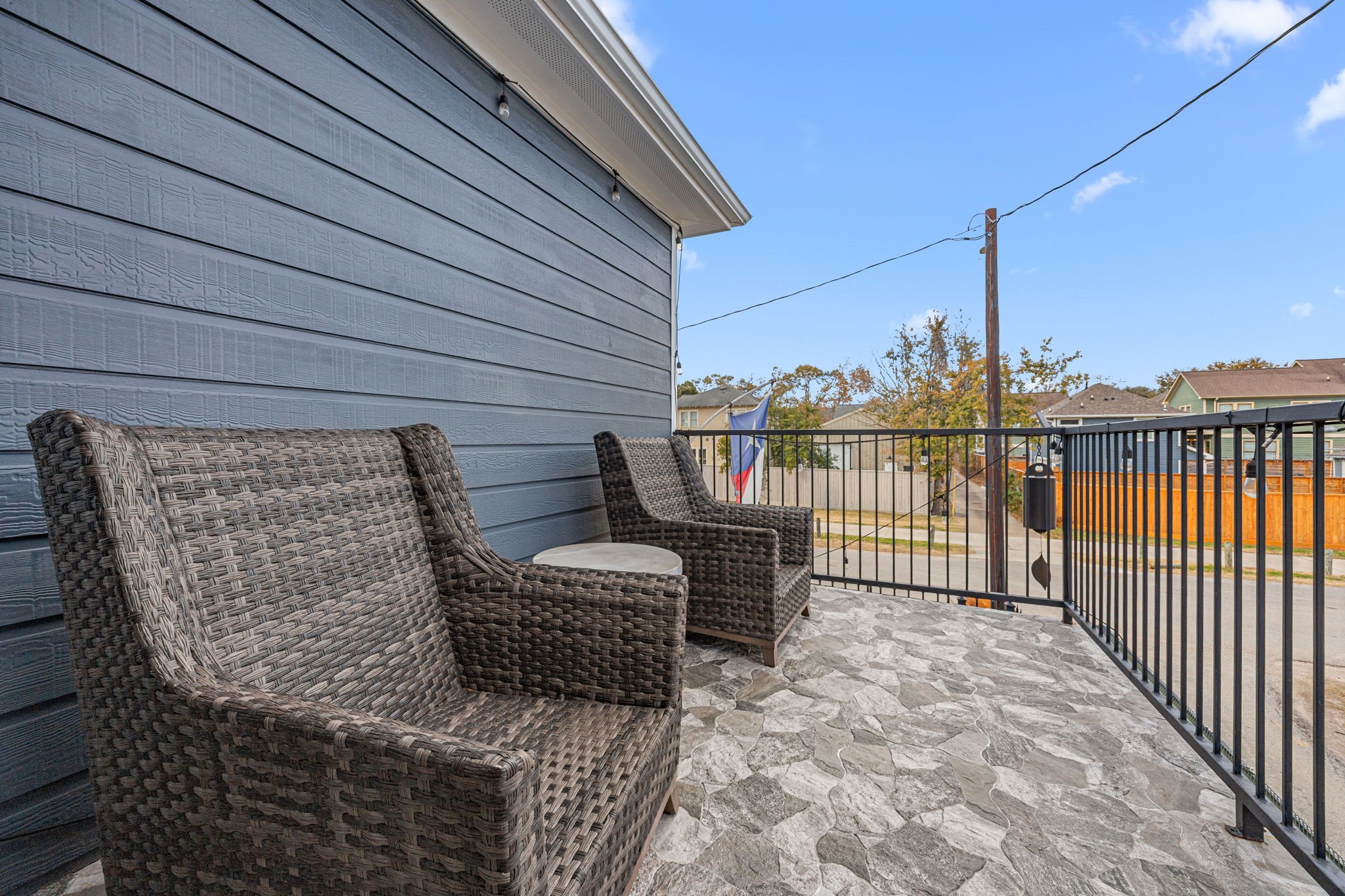 202 East 7th Street Houston, TX 77007 - Photo 22 of 27 Private second-floor balcony with stone flooring and railing, ideal for morning coffee or evening wind-downs. Overlooks the hike and bike trail.
