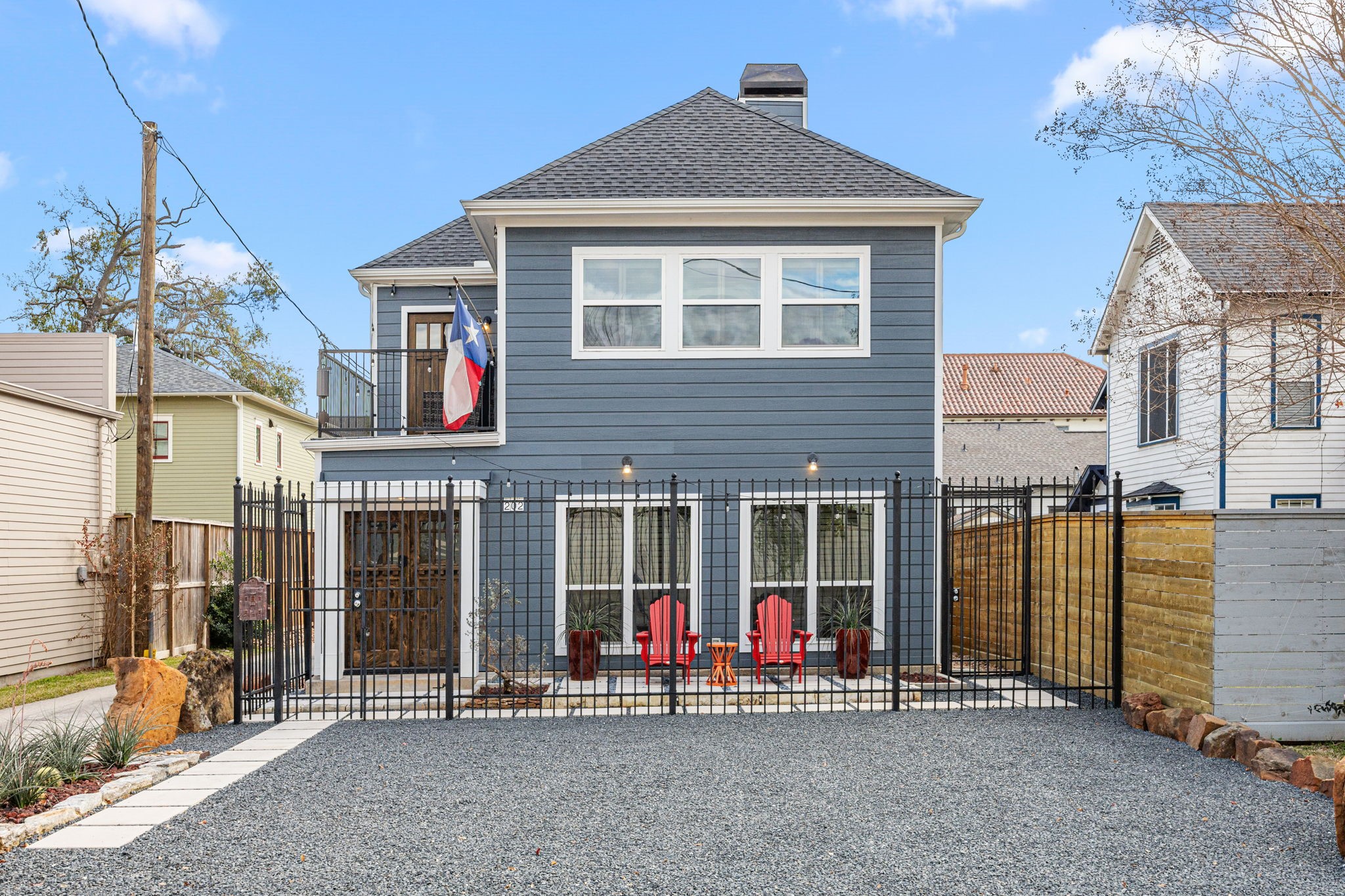 202 East 7th Street Houston, TX 77007 - Photo 27 of 27 Modern two-story exterior with fresh siding, gated entry, and inviting front patio creating strong curb appeal and privacy.