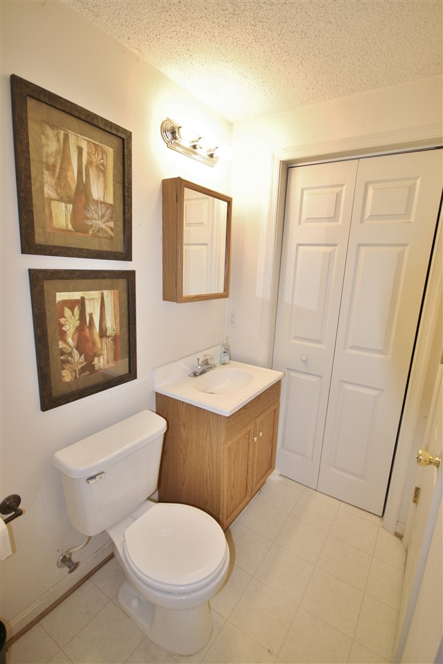201 William Road Ruckersville, VA 22968 - Photo 18 of 23 a bathroom with a toilet sink and mirror