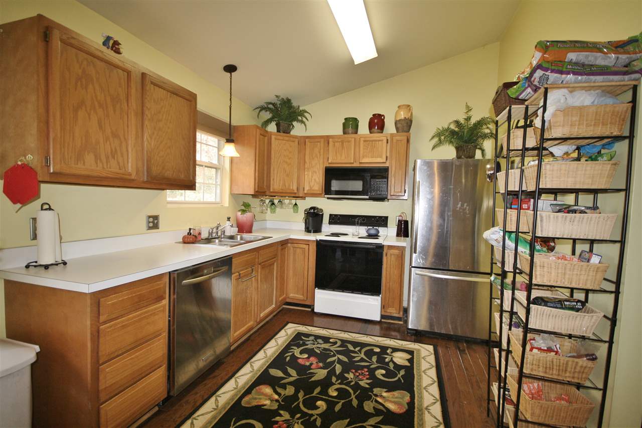 201 William Road Ruckersville, VA 22968 - Photo 5 of 23 a kitchen with stainless steel appliances granite countertop a refrigerator sink and microwave