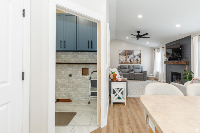 972 West 2840th Street South Logan, UT 84321 - Photo 5 of 46 Open-concept living area with vaulted ceilings, recessed lighting, and wood-finish flooring