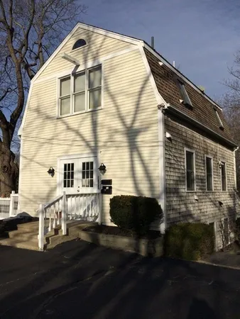 a view of a house with backyard