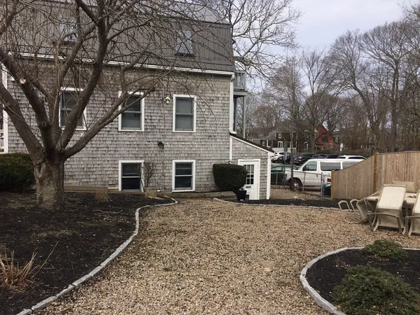a view of a patio with table and chairs and potted plants