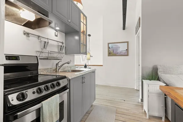 a kitchen that has a sink and a stove