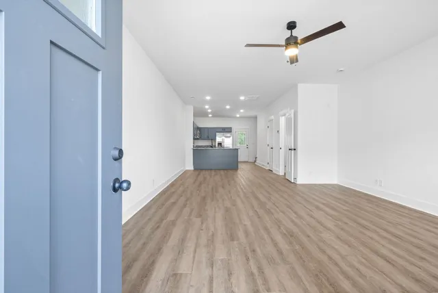 a large kitchen with granite countertop a sink a oven and a granite counter top