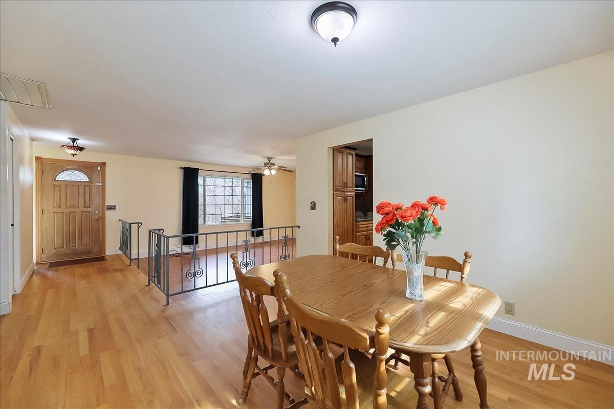 11875 West Hidden Valley Rim Road Boise, ID 83709 - Photo 12 of 36 Dining area featuring light wood-type flooring and ceiling fan