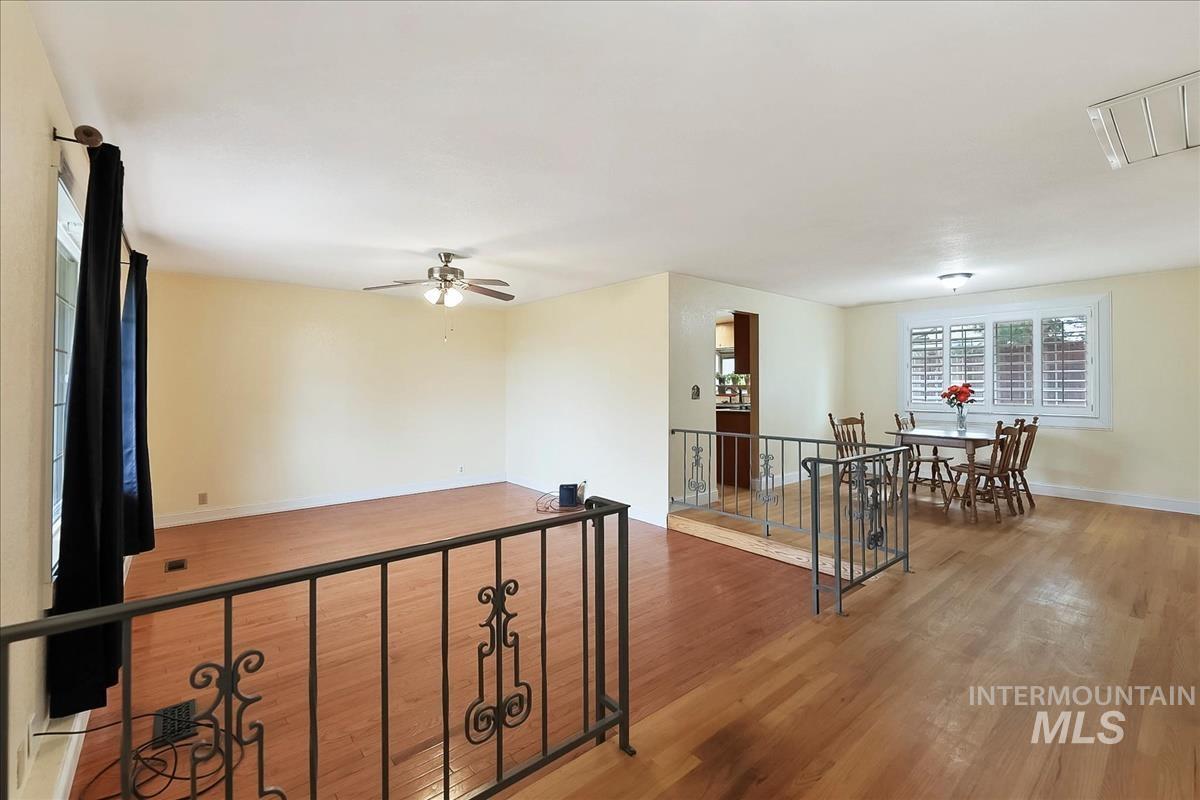 11875 West Hidden Valley Rim Road Boise, ID 83709 - Photo 16 of 36 Corridor featuring wood finished floors and baseboards