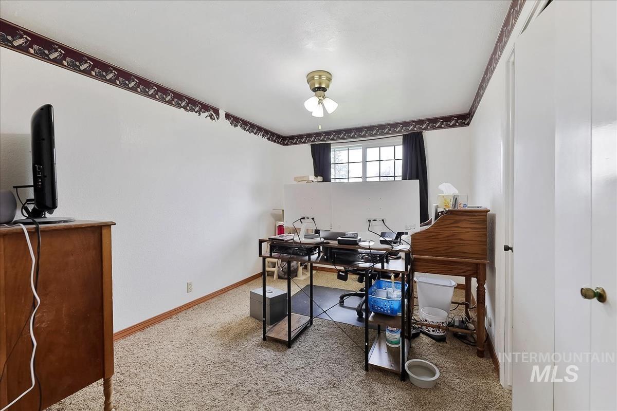 11875 West Hidden Valley Rim Road Boise, ID 83709 - Photo 25 of 36 Home office with baseboards and light carpet