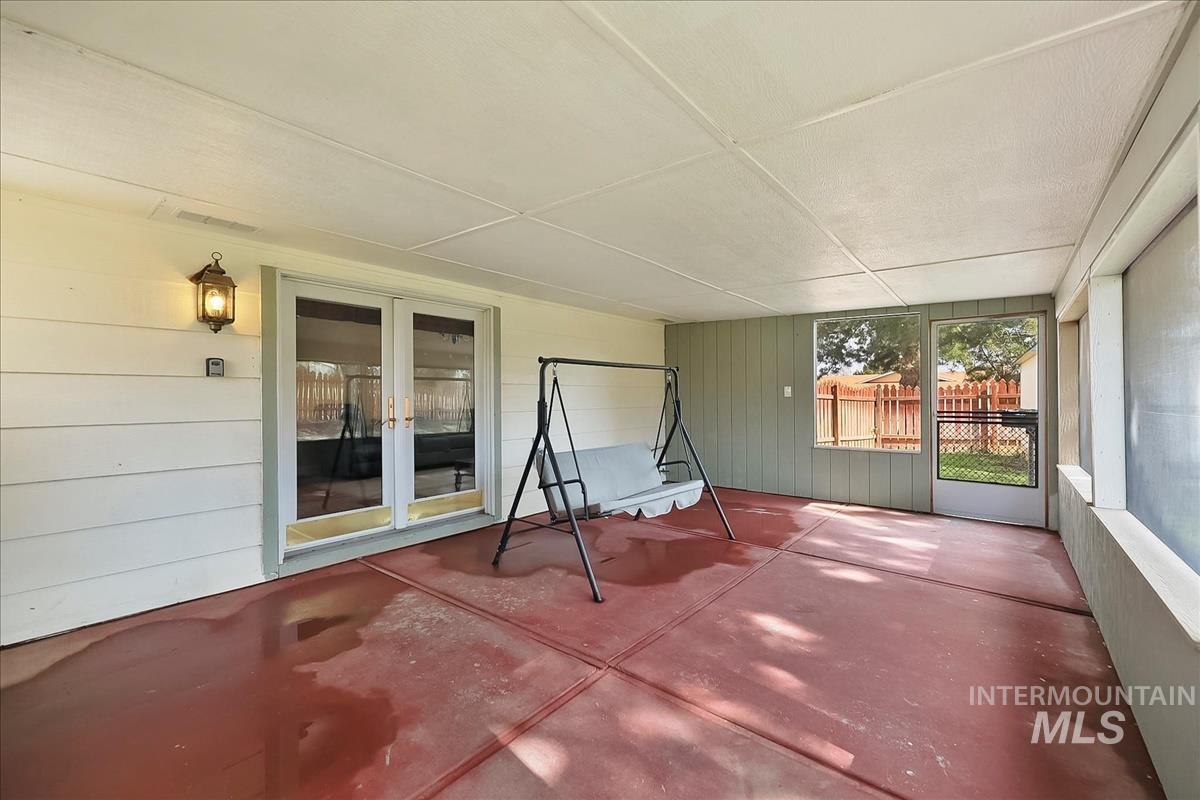 11875 West Hidden Valley Rim Road Boise, ID 83709 - Photo 27 of 36 Unfurnished sunroom with french doors and a patio area