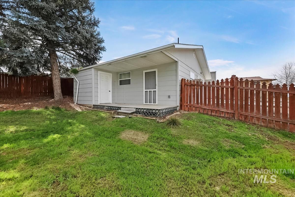 11875 West Hidden Valley Rim Road Boise, ID 83709 - Photo 34 of 36 Rear view of property with a fenced backyard