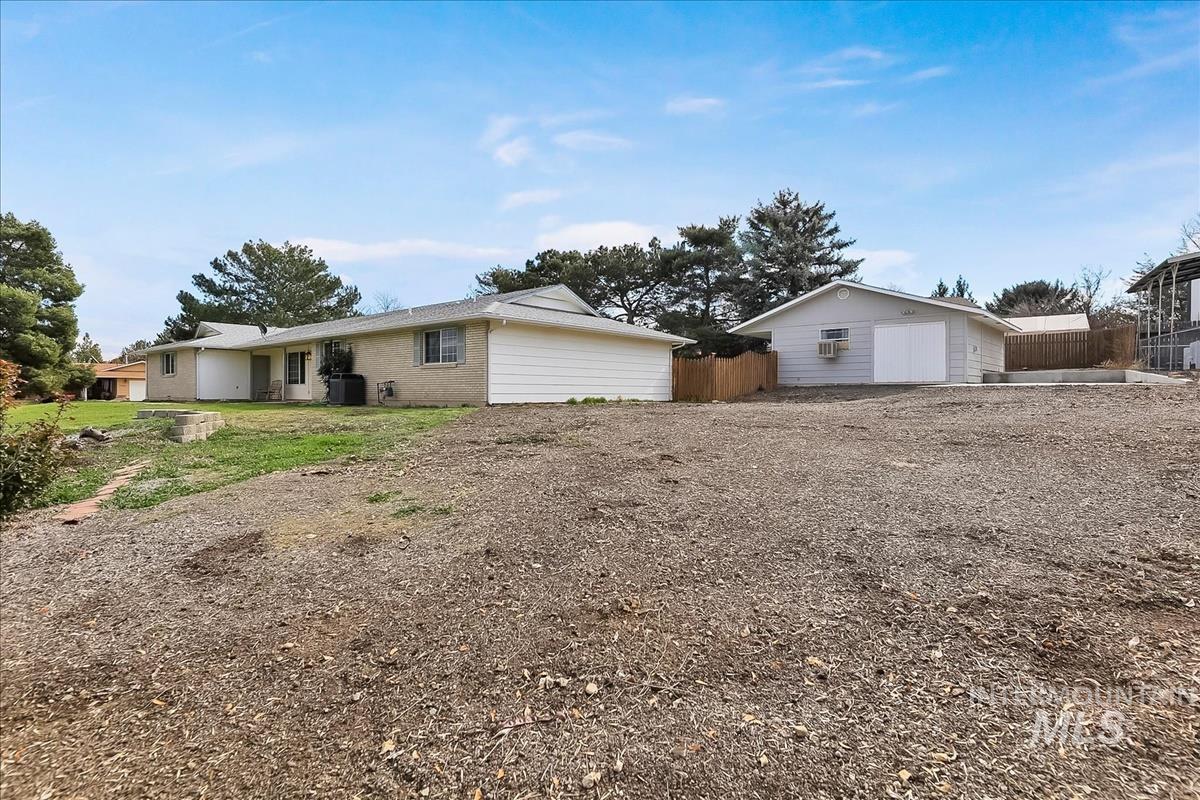 11875 West Hidden Valley Rim Road Boise, ID 83709 - Photo 35 of 36 Back of house with an outbuilding and brick siding