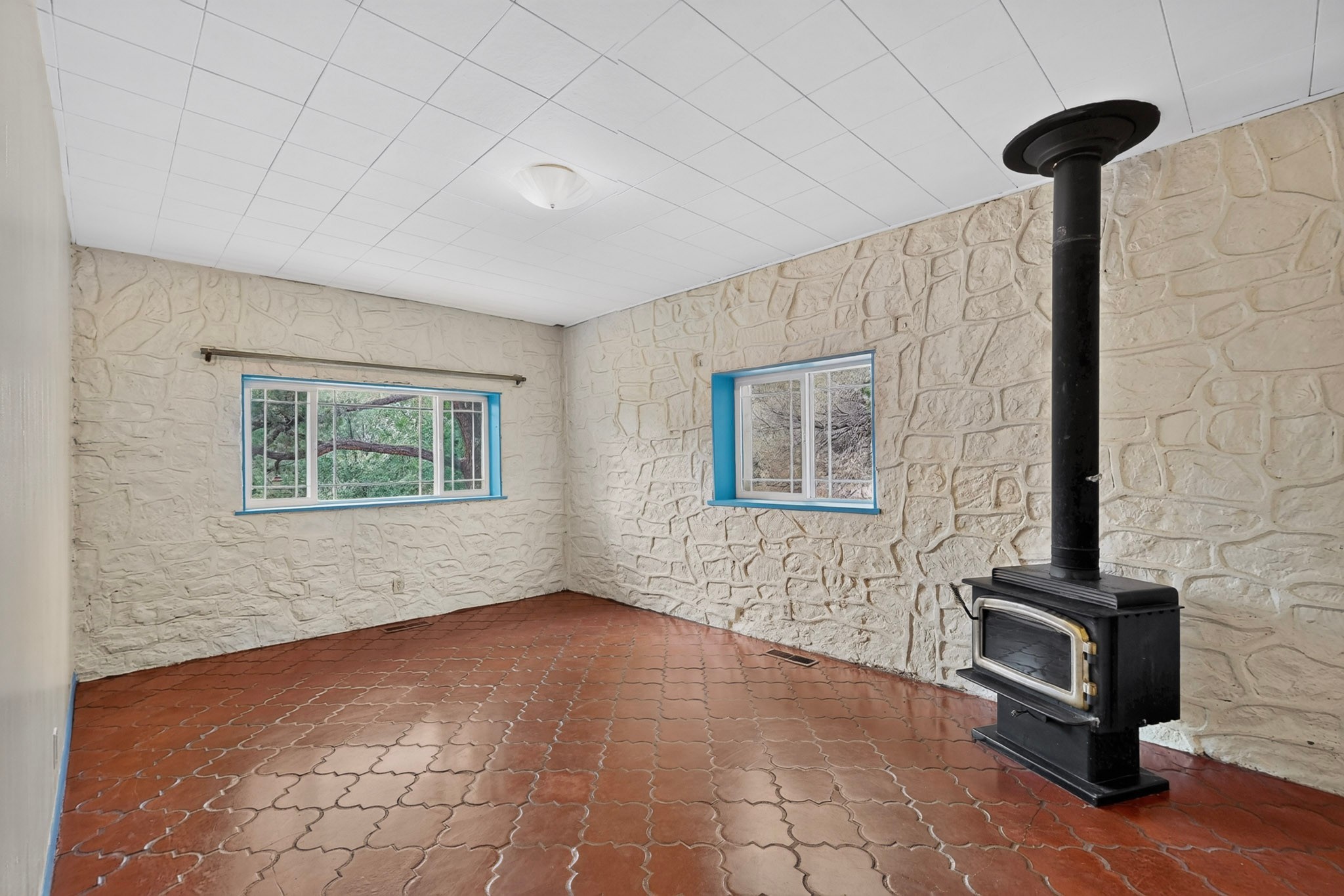 5 County Rd B51A Pecos, NM 87552 - Photo 8 of 64 Den with wood burning stove