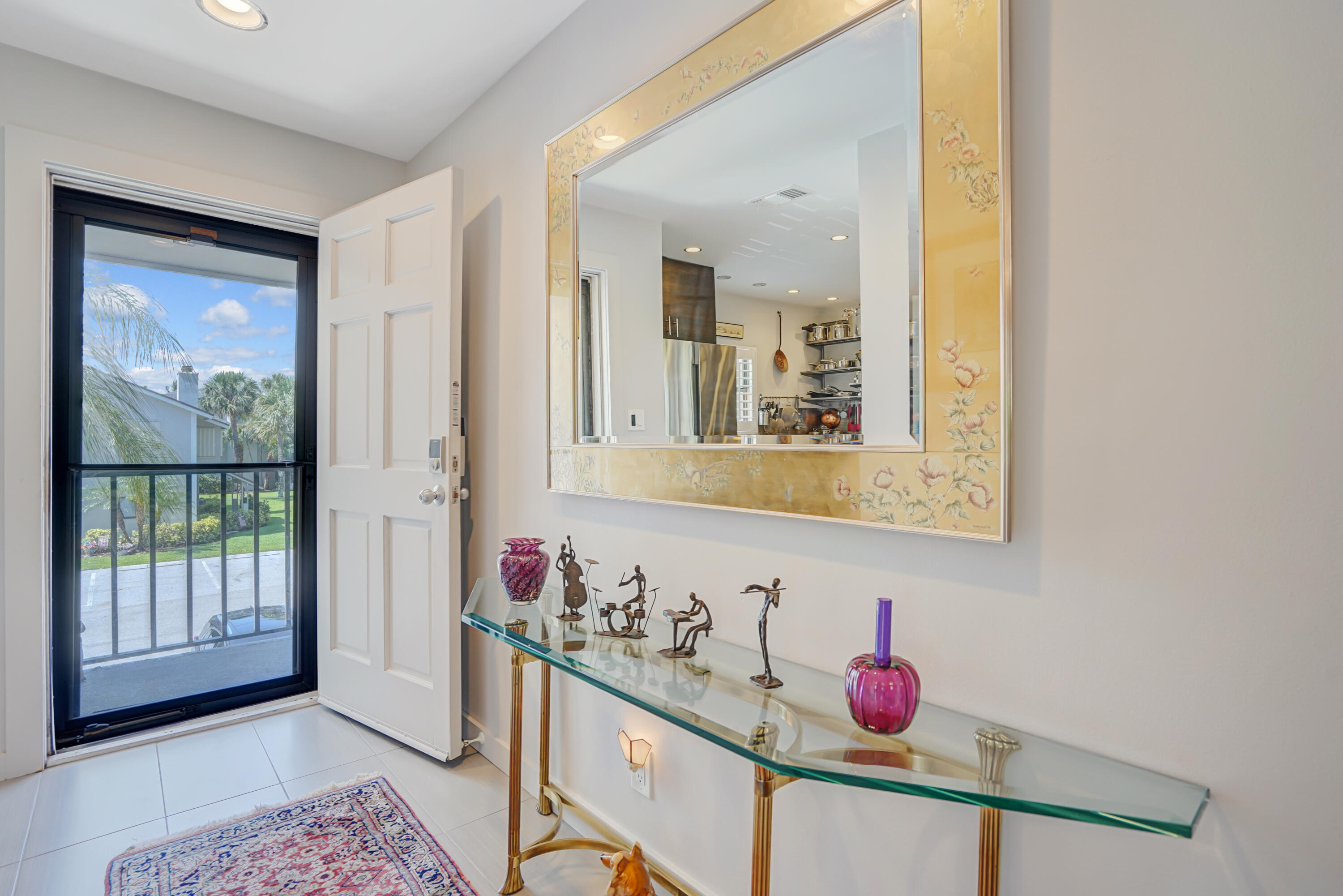 102 Clubhouse Circle Jupiter, FL 33477 - Photo 11 of 35 a bathroom with a sink mirror and vanity