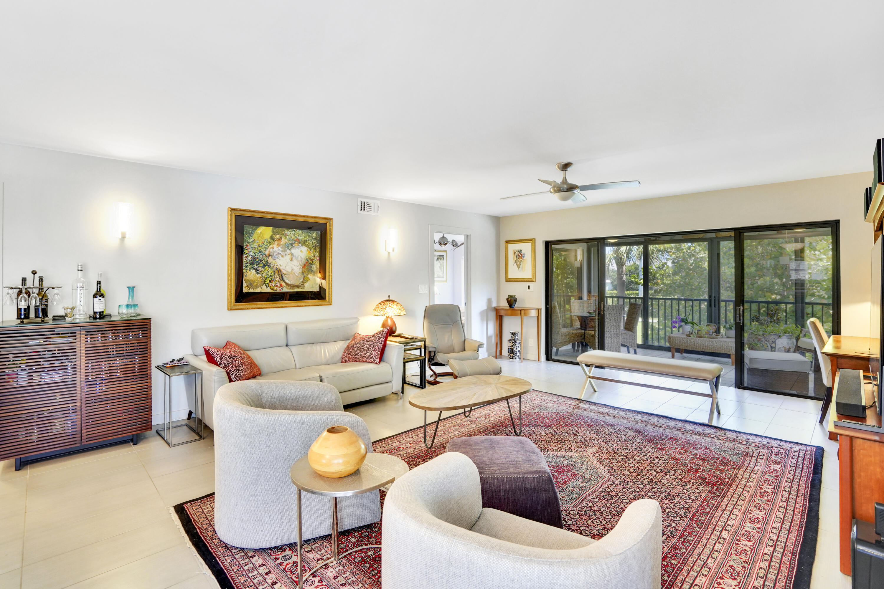 102 Clubhouse Circle Jupiter, FL 33477 - Photo 20 of 35 a living room with furniture and a large window