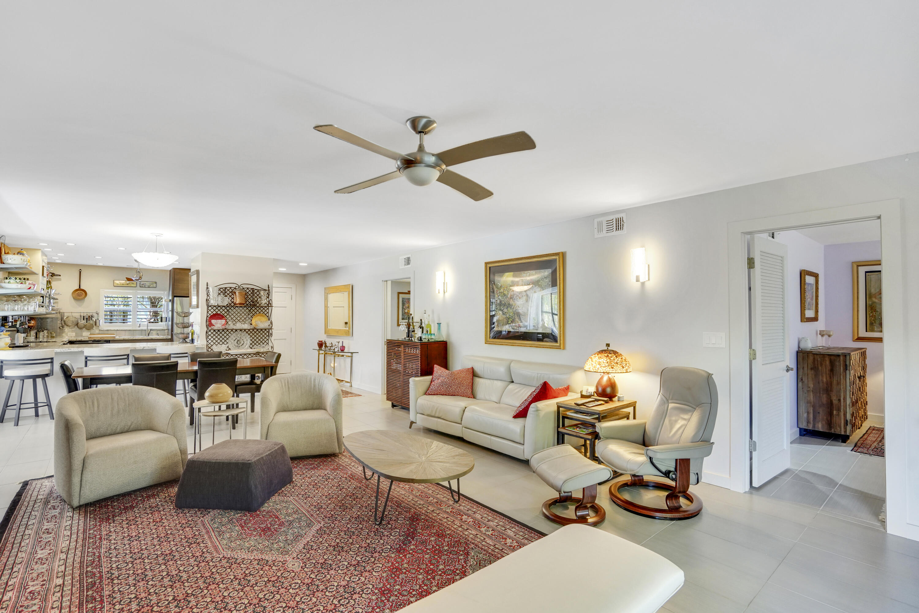 102 Clubhouse Circle Jupiter, FL 33477 - Photo 22 of 35 a living room with furniture and a large window