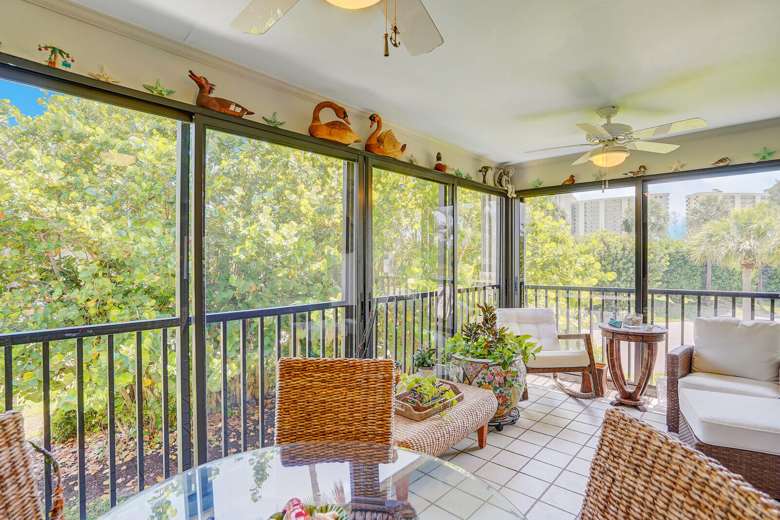 102 Clubhouse Circle Jupiter, FL 33477 - Photo 24 of 35 a living room with furniture and a large window