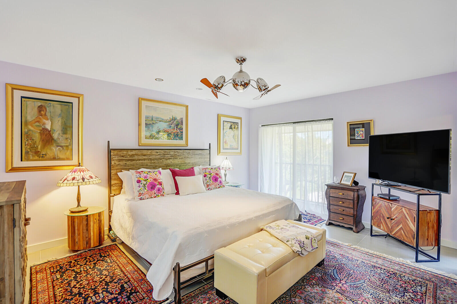 102 Clubhouse Circle Jupiter, FL 33477 - Photo 27 of 35 a bedroom with a bed and flat screen tv