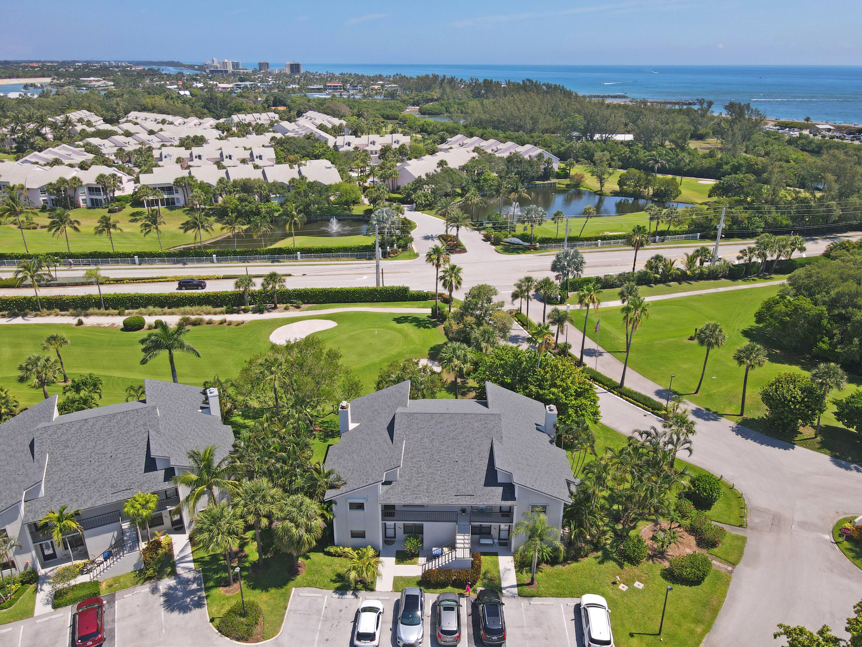 102 Clubhouse Circle Jupiter, FL 33477 - Photo 4 of 35 an aerial view of a houses with a lake view